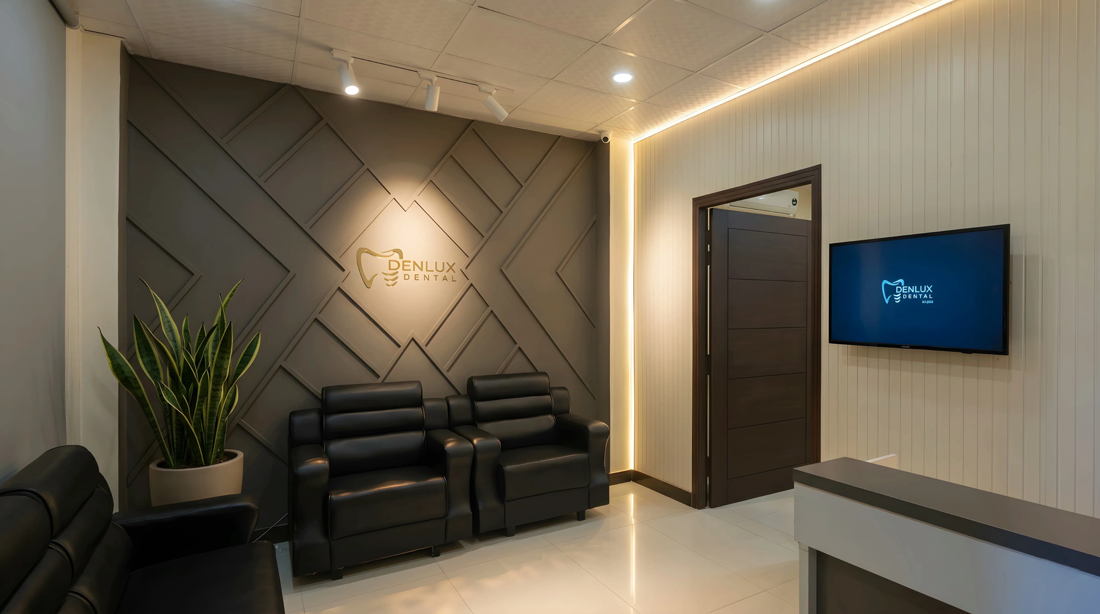The Denlux reception, warm lighting against a dark panelled feature wall